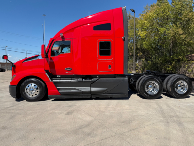 Kenworth T680 tractor in red profile view showing cab, sleeper, and dual rear axles with chrome wheels.