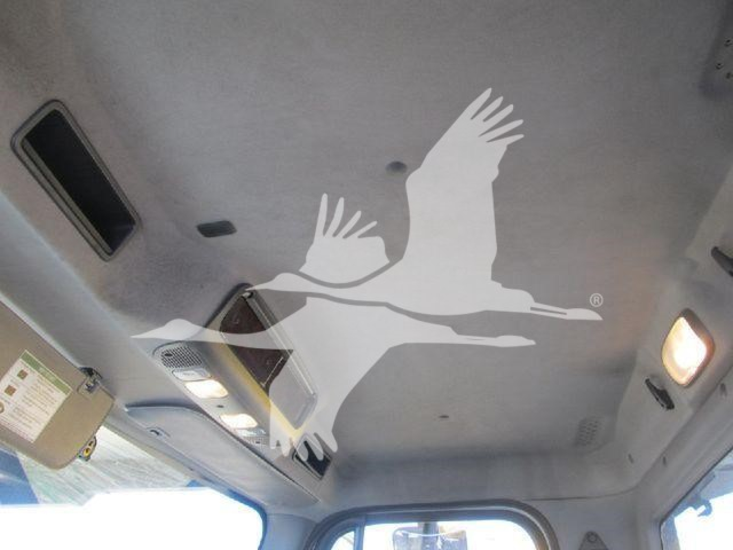 Freightliner M2 106 interior roof with light and vents visible.