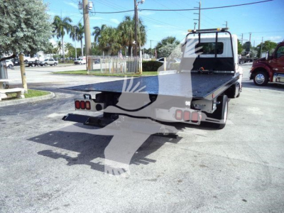 Back view of a 2020 Hino 258Al rollback truck showing flatbed and rear hitch.