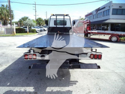 Tow truck flatbed rear view showing platform and taillights with Hino 258Al equipment