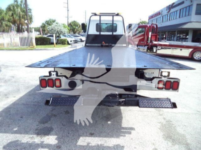 Rear view of 2020 Hino 258Alp rollback tow truck showing flatbed and taillights.