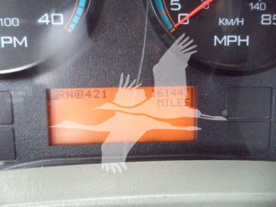 Dashboard of a 2019 International Durastar 4300 showing instrument cluster and an orange digital odometer reading with miles. Visible texts include PRHD@421, 61447 MILES, MPH, KM/H, and partial gauges.
