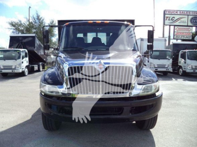 International Durastar 4300 flatbed truck facing front showing chrome grille and headlights.