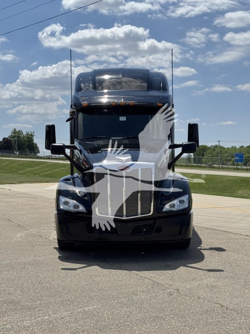 Peterbilt 579 conventional sleeper truck front view showing large grille and headlights with a watermark across the image.