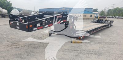 Lowboy trailer shows Fontaine 55Mx equipment with black frame, tandem axles, flatbed deck, rear ramps, and dual gooseneck connection area.