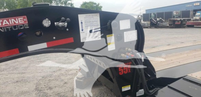 Trailer cab area showing control panel decals and warning labels on a Fontaine 55Mx lowboy trailer.