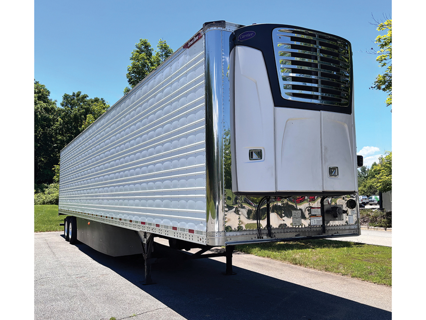 Great Dane aluminum reefer trailer undercarriage and front refrigeration unit showing riveted aluminum walls and stainless dash refrigeration unit.