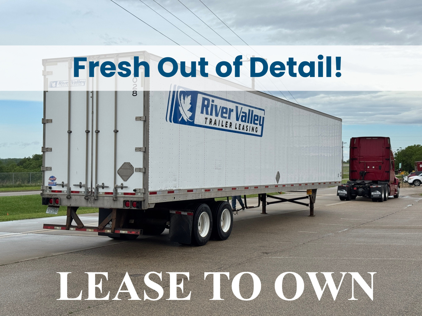 Truck trailer with River Valley Leasing logo showing a white trailer and a red tractor in a parking lot. Overlay text reads 'Fresh Out of Detail!' and 'LEASE TO OWN'.