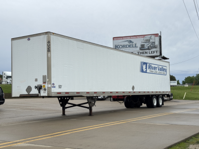 Utility 4000DX trailer in view showing white trailer with River Valley trailer sales logo and rear doors, 53' length, front area over hitch.