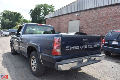 Chevrolet Silverado 1500 pickup truck with tailgate text CHEVROLET, in-service condition, visible rear and left side view.