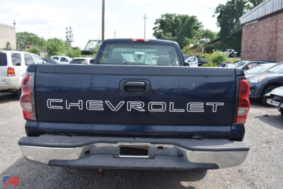 Chevrolet pickup bed tailgate with CHEVROLET lettering in chrome on a dark blue 2005 Silverado 1500, rear view, parts only listing.