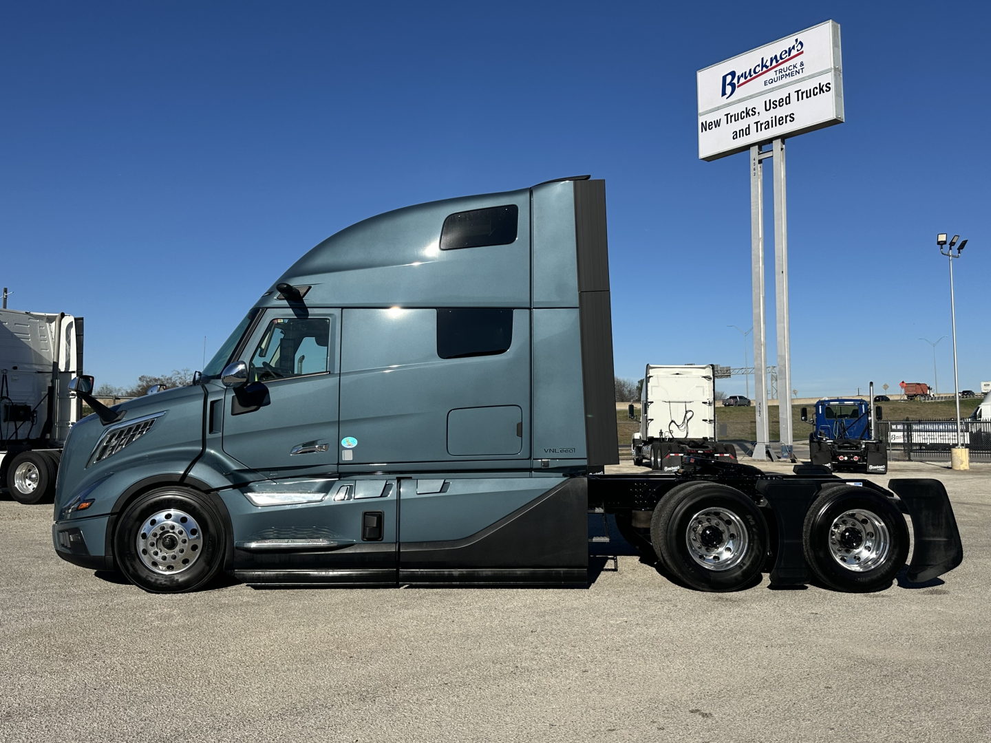 Volvo VNL cab and chassis side view showing tractor-trailer features and tires