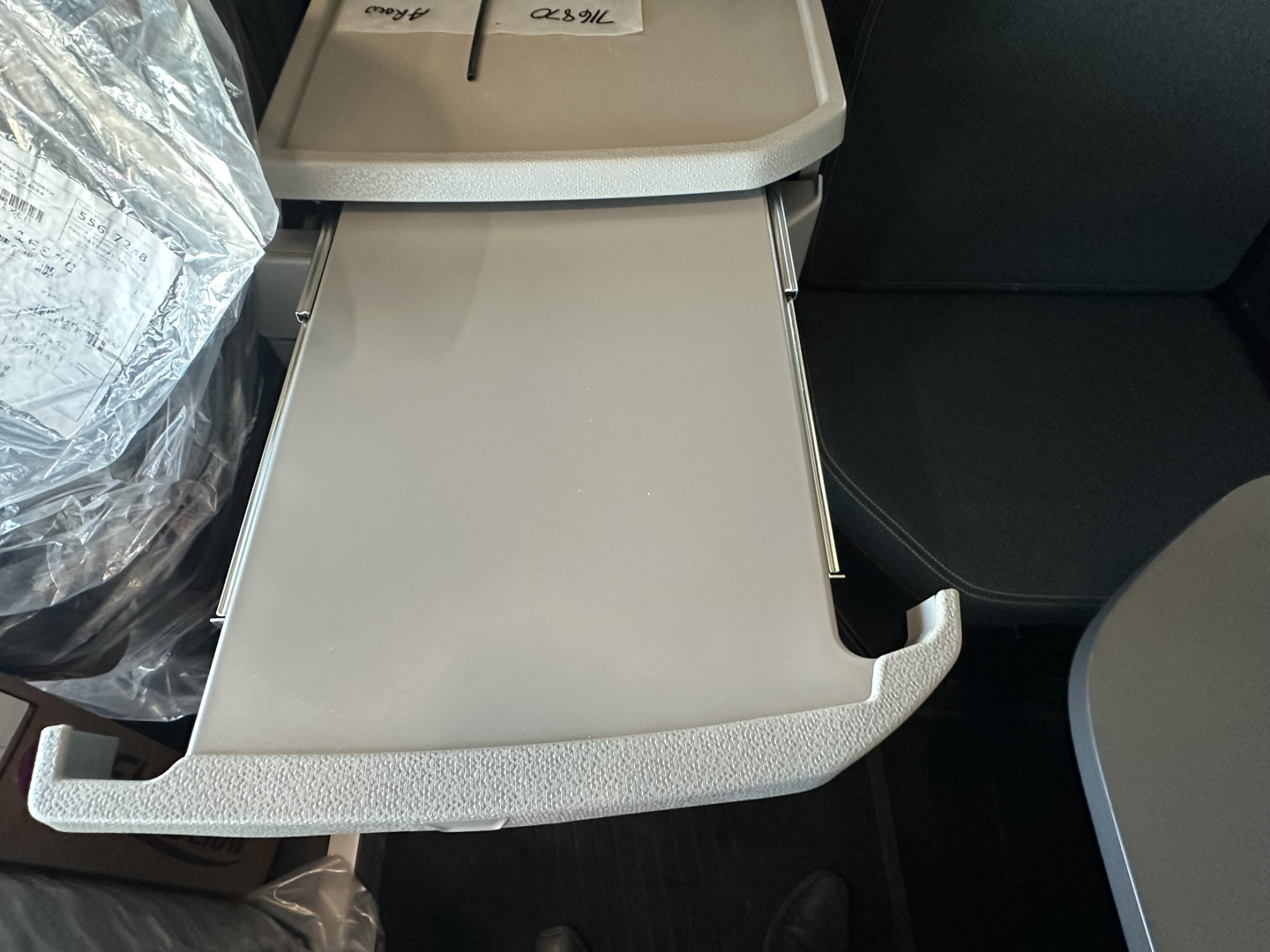 Volvo truck interior drawer/console with open pull-out tray in a new 2026 Volvo VNL64T860, showing light gray plastic and textured handle.