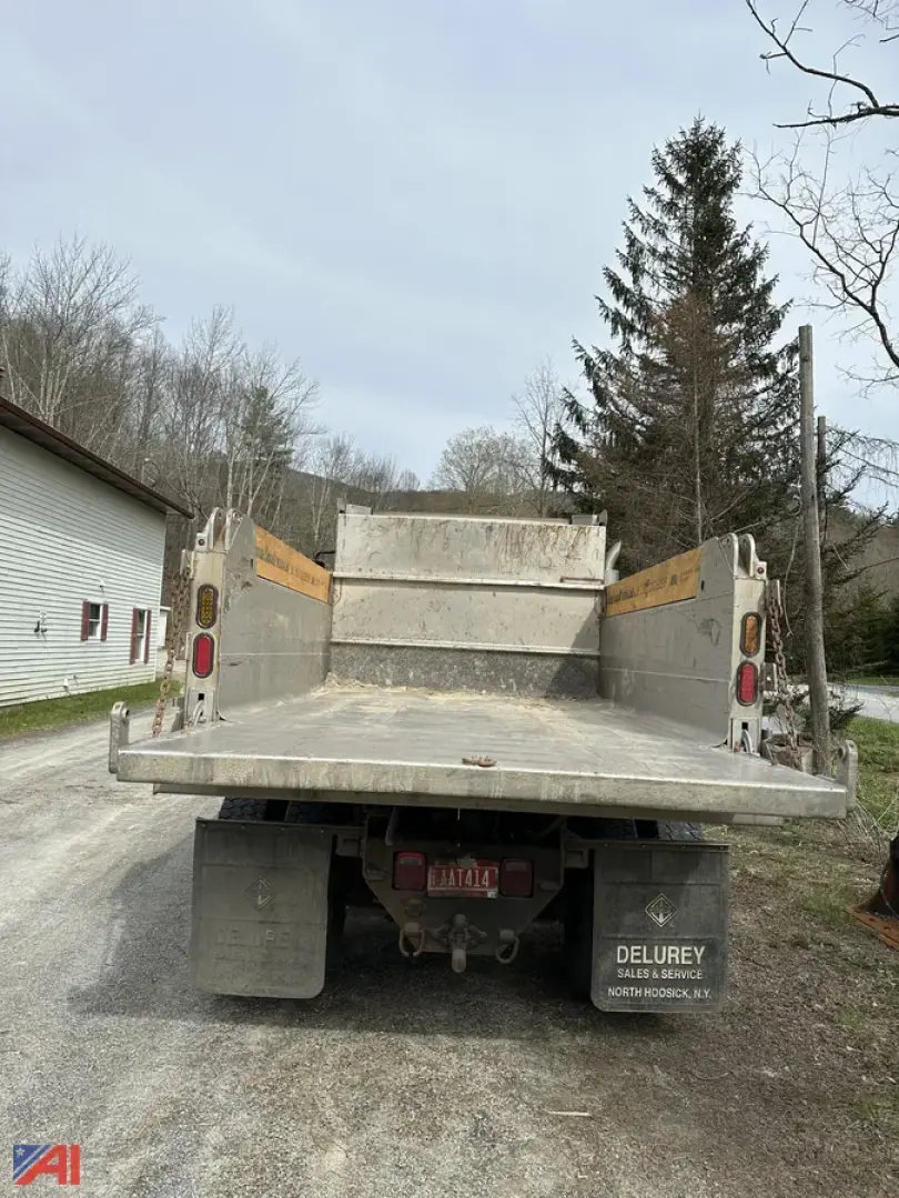 Dump truck bed of a 2018 International 4400SBA in-service rear view showing dump bed and taillights.