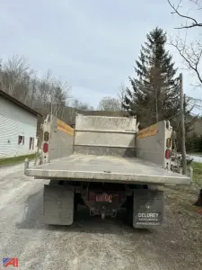 Dump truck bed of a 2018 International 4400SBA in-service rear view showing dump bed and taillights.
