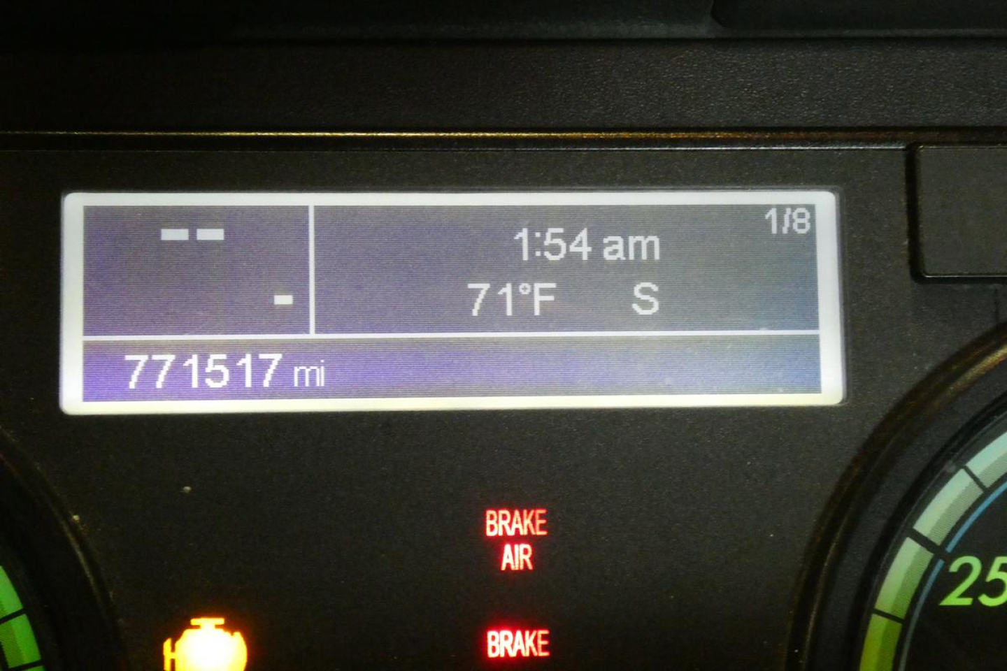 Dashboard display of a 2016 Freightliner Cascadia 125 showing 771517 mi, time 1:54 am, temperature 71°F, and compass S.