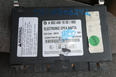 Electronic CPTC reset label on a Freightliner CASCADIA 125 engine control module with warning sticker and serials visible.