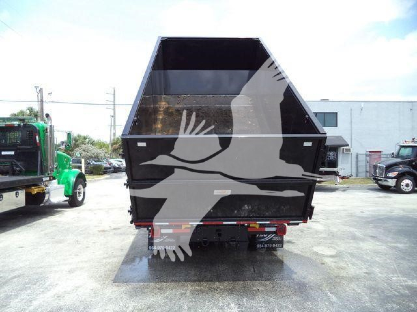 Dump bed of a 2023 Chevrolet Silverado 6500HD truck showing cargo bed and rear view with stock number plate area visible.
