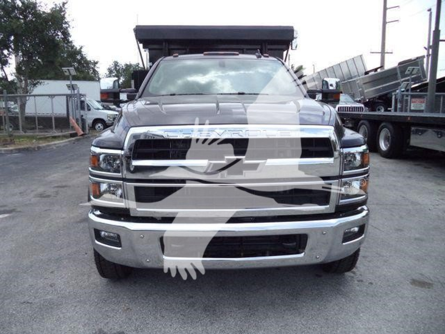Front view of a 2023 Chevrolet Silverado 6500HD truck showing chrome grille and bumper.