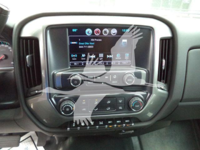 Interior dashboard of a Chevrolet Silverado 6500HD showing touchscreen infotainment system and climate controls.