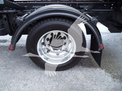 Rear wheel and fender on a 2023 Chevrolet Silverado 6500HD chassis truck showing wheel, tire, and fender arch.