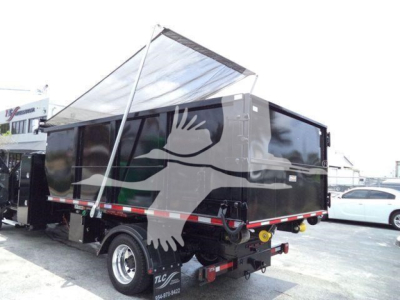 Dump trailer with open-top black hopper showing side and rear view, white push bar, and reflective tape along sides.