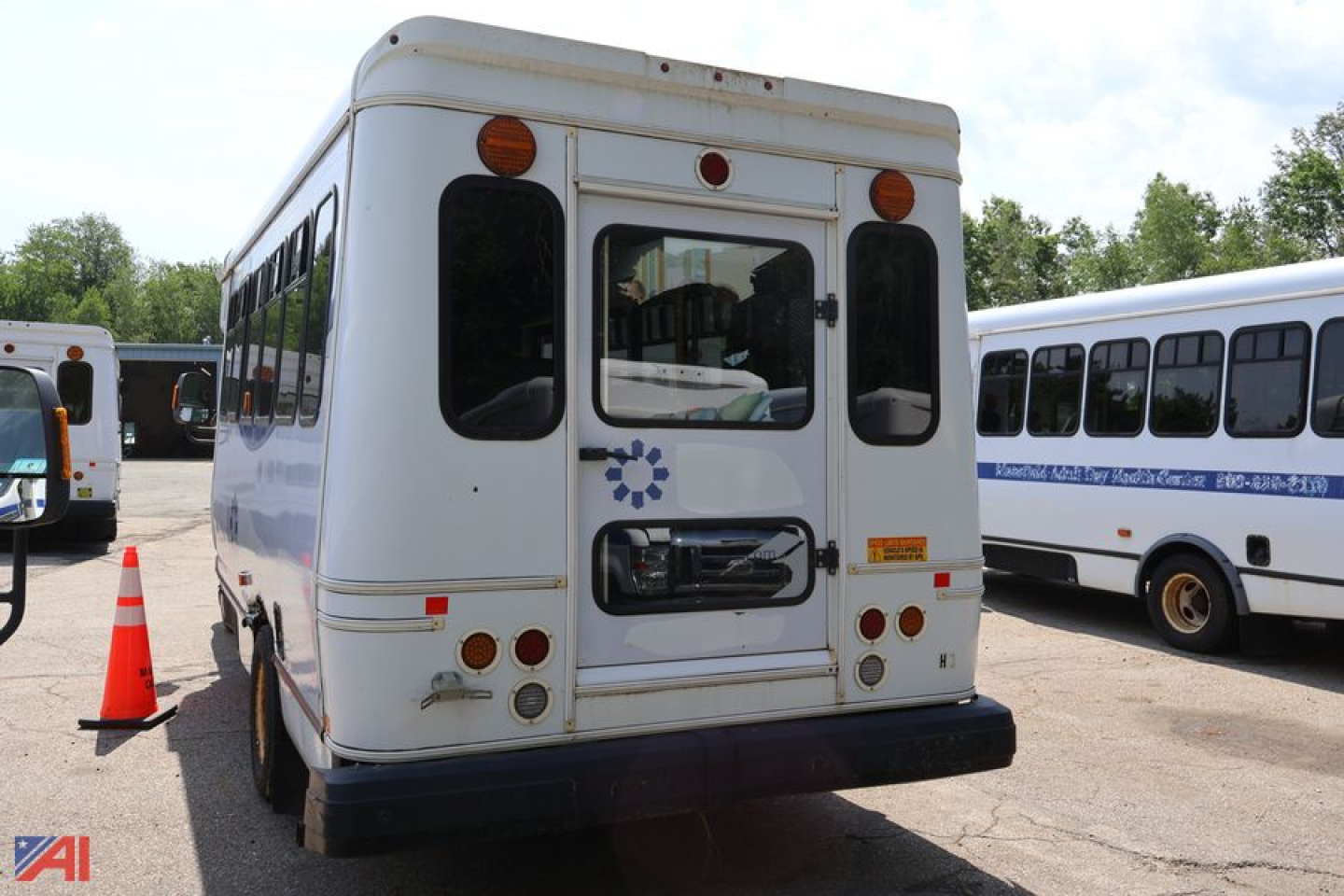 Ford E350 (H-3) wheelchair bus rear view showing back door and taillights