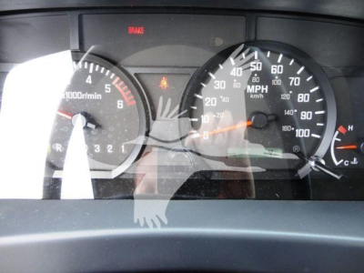 Dashboard view of a 2024 Isuzu NPRR rollback truck showing gauge cluster with tachometer, speedometer, brake indicator, and warning lights.