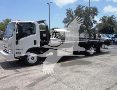 Isuzu NPR truck in a rollback configuration showing the cab and flatbed with hydraulic equipment in foreground.