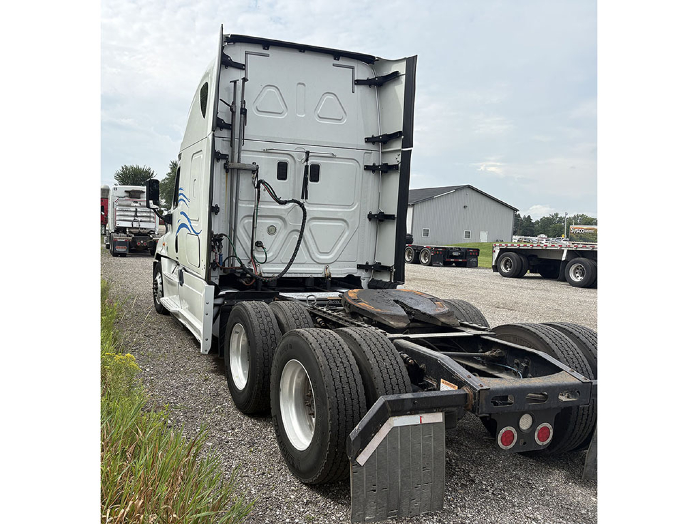 Freightliner Cascadia125 tractor rear view showing chassis and fifth wheel area with dual rear axles.