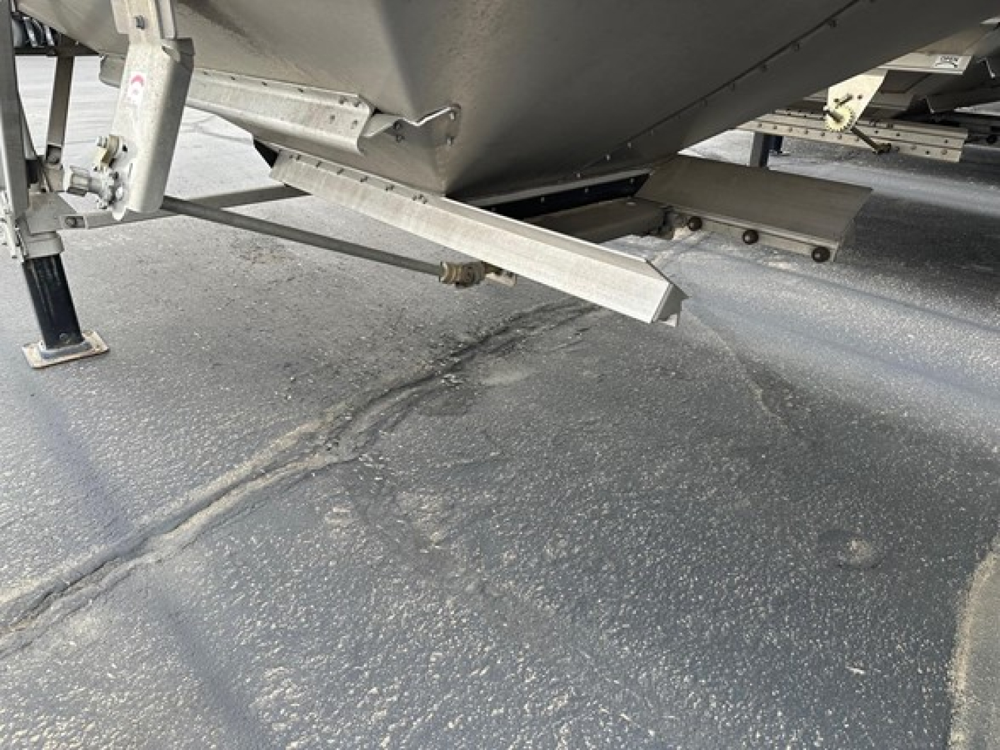 Trailer undercarriage showing support legs and frame of a 2024 Timpte Super Hopper.