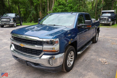 2017 Chevrolet Silverado LT 1500 Crew Cab pickup truck front-left view showing blue body, chrome grille, and four-door crew cab.