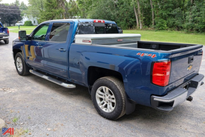 Chevrolet Silverado LT 1500 crew cab pickup truck in blue, 4x4, with aluminum toolbox in bed and running boards visible.