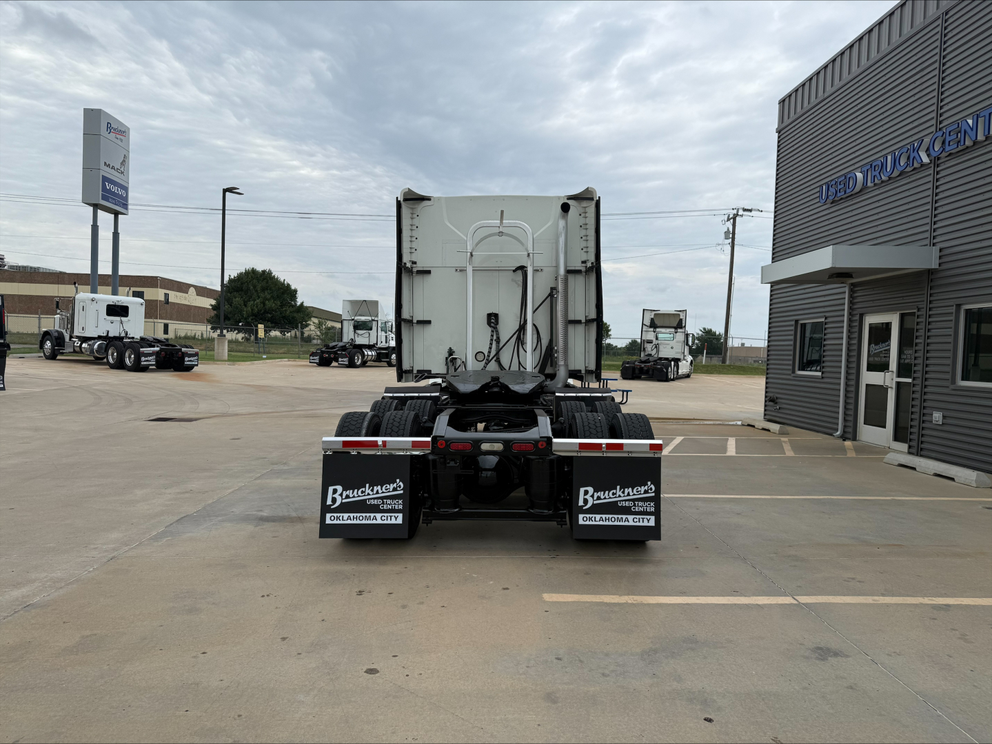 Rear view of a 2020 Mack ANTHEM sleeper truck showing trailer hitch area, rear bumper, and mud flaps with Byers Trucks branding.