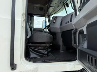 Cab interior of a 2020 Mack Anthem truck showing driver seat, steering wheel, and dashboard from open door view.