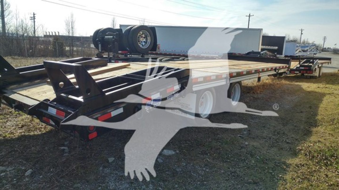 Flatbed trailer with dual axles showing rear and side, dealer watermark, no legible branding text visible on components.