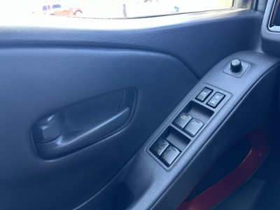 Nissan Frontier interior door panel and window control switches in view