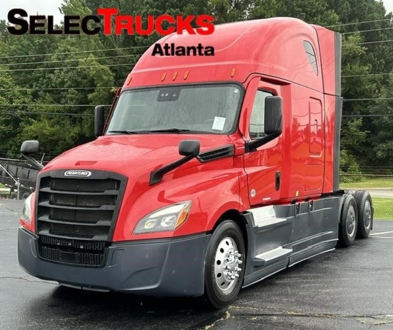 Freightliner Cascadia sleeper tractor in red, front-left view with SelectTrucks Atlanta watermark; chrome mirrors, black grille, headlights, and side steps visible.
