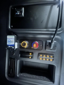 Dashboard panel of a Freightliner Cascadia showing climate control dials, ignition area, and various switches; VIN/stock not visible in image.