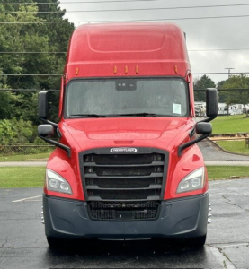 Freightliner Cascadia truck front view showing cab, grille, headlights and mirror housings.