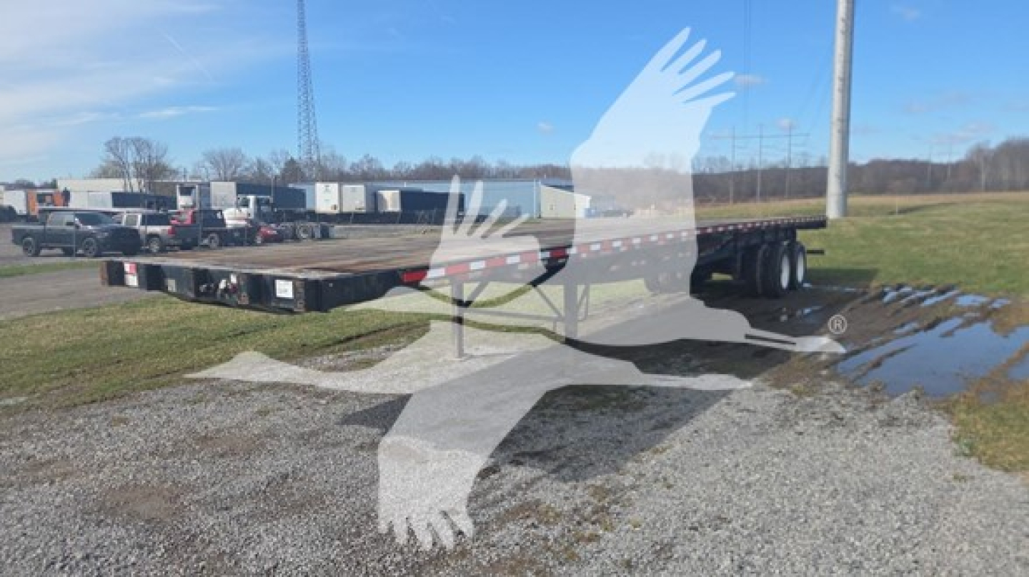 Great Dane steel flatbed trailer showing flatbed and wheels with VIN 1GRDM9627GH730377 visible on listing.