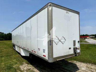 Trailer side and rear of a white 2017 Wabash dry van trailer showing side panel details, NCW codes 45 54 0 and 53' on the lower side, and corner rear with misaligned doors.