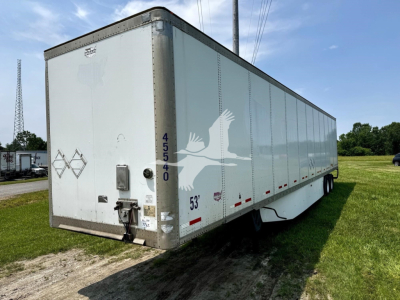 Box trailer with rear doors, side markings, and numbers: 45540 vertical on rear corner; 53" height marking near side; small diamond placard; rear frame hitch and lock mechanism; taillight and reflectors along lower edge.