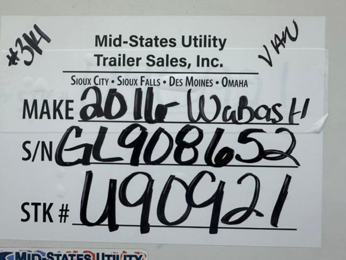 Tag showing Mid-States Utility Trailer Sales info for a 2016 Wabash van with handwritten VIN and S/N, stock U90921, S/N GL908652, STK U90921.