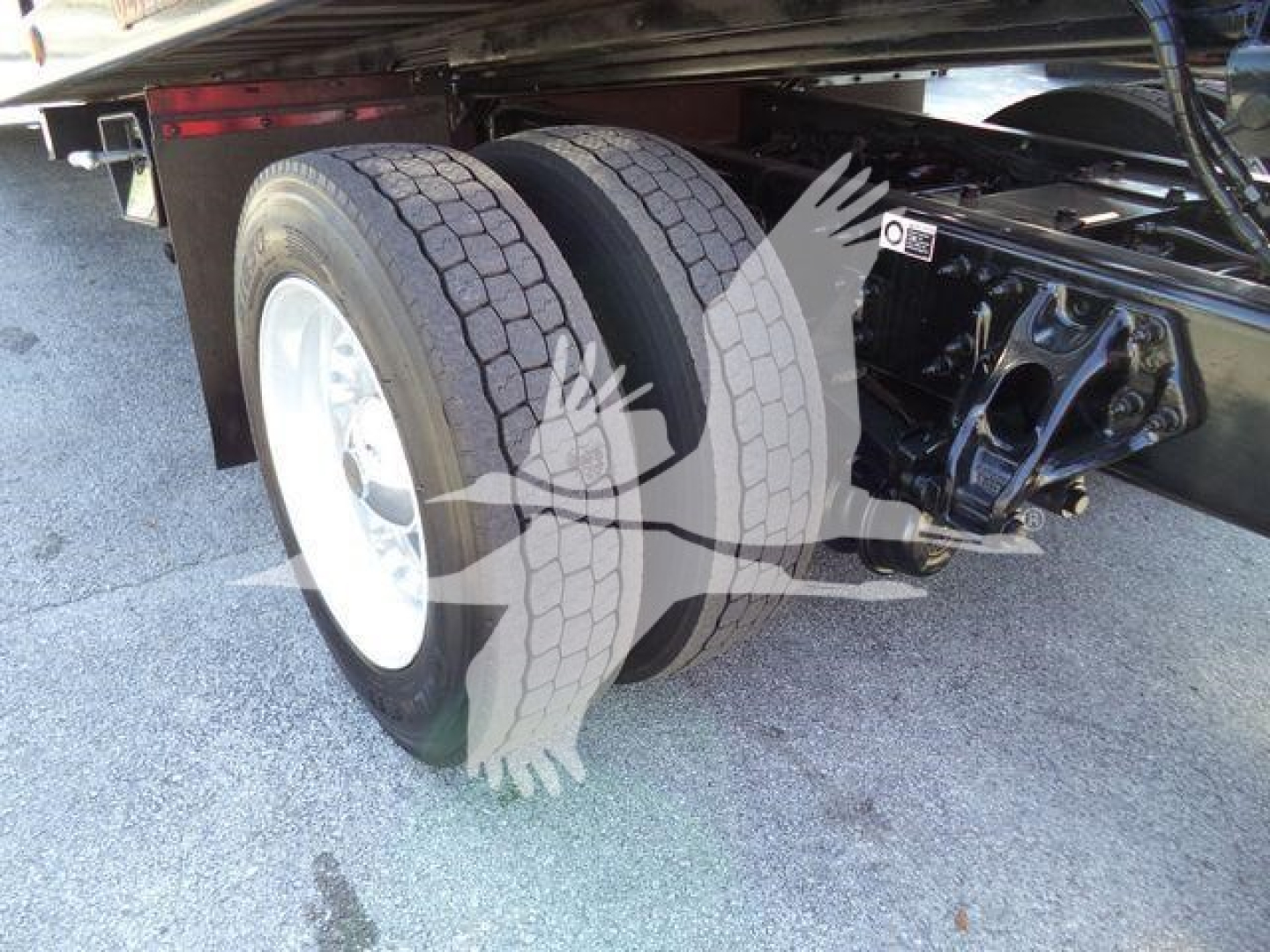 Peterbilt 337 rollback truck rear dual wheels and suspension view showing tires and chassis label