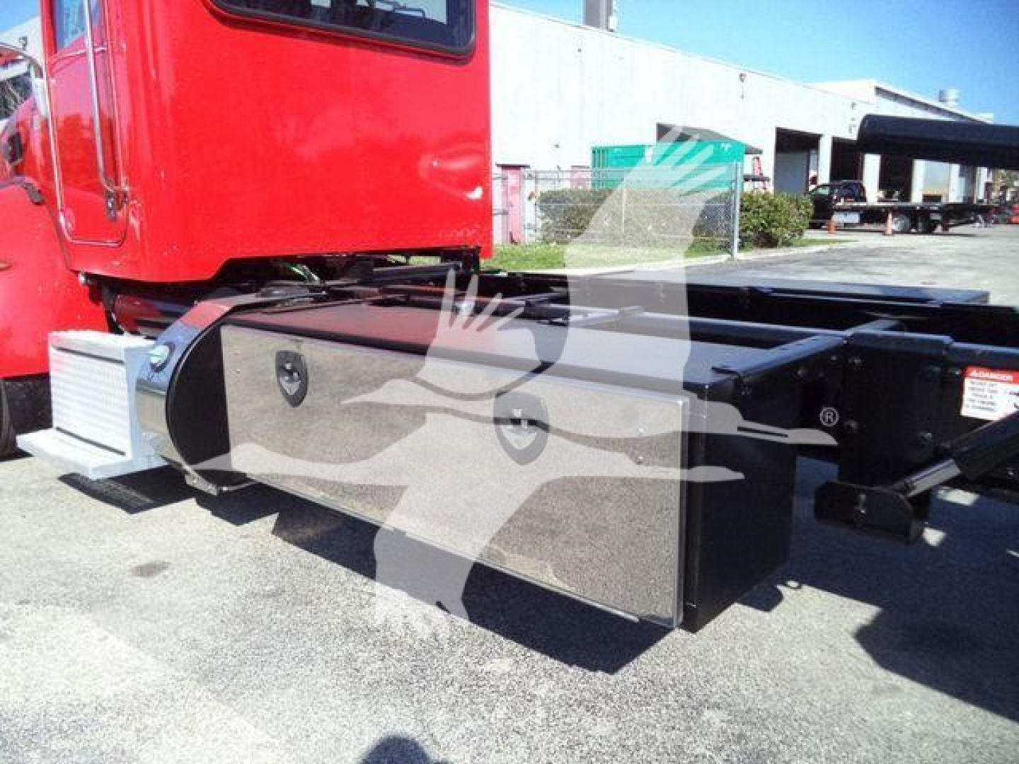 Peterbilt 337 rollback truck side view showing large rectangular toolbox/drawer and chassis area.