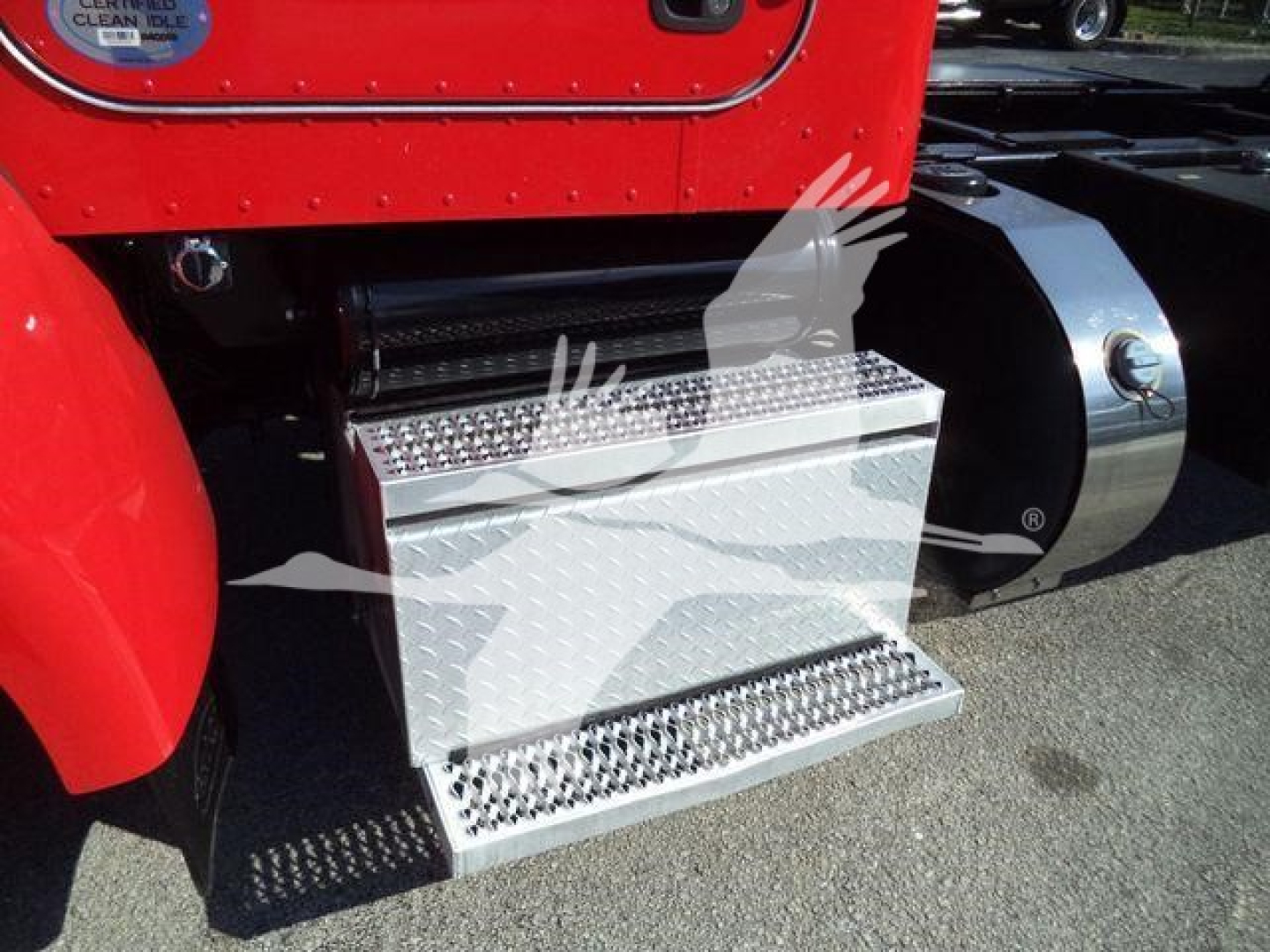 Peterbilt 337 side step/footboard with diamond plate metal steps attached to the truck chassis.