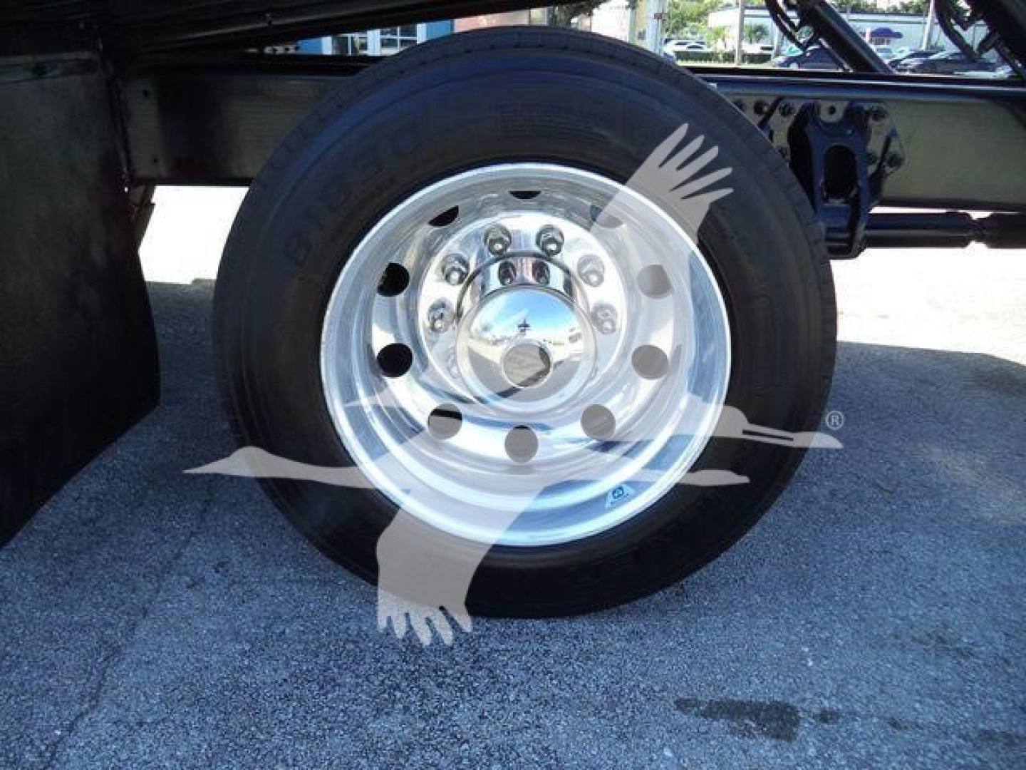 Peterbilt 337 wheel and hub showing polished chrome rim and tire.