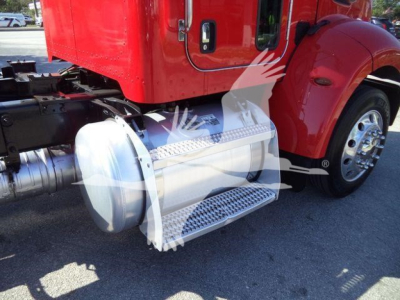 Side view of a red 2020 Peterbilt 337 truck showing a chrome fuel tank guard/step and wheel area.