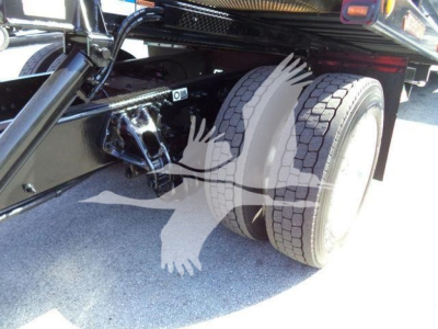 Peterbilt 337 rollback truck dual rear wheels and undercarriage view showing frame and suspension components.